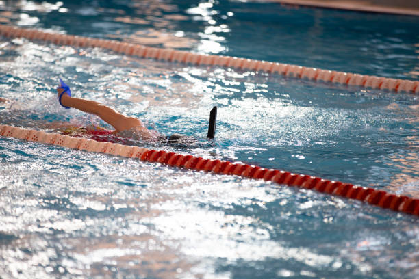 istock Child athlete swims in the pool. Swimming section. 1317253702