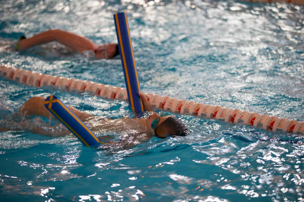 istock Child athlete swims in the pool. Swimming section. 1317253855