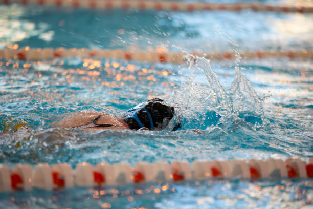 istock Child athlete swims in the pool. Swimming section. 1317253933