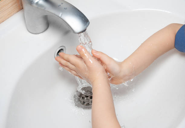 istock child washes his hands in the sink 1317254265
