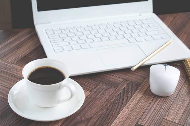 istock Mobile phone and telecommuting images on Herringbone desk. 1317257081
