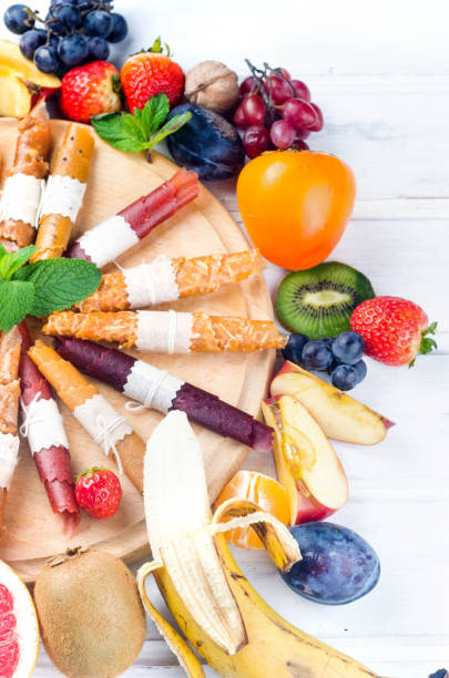 istock assorted ripe fruits and dried chips on grey background. 1317257212
