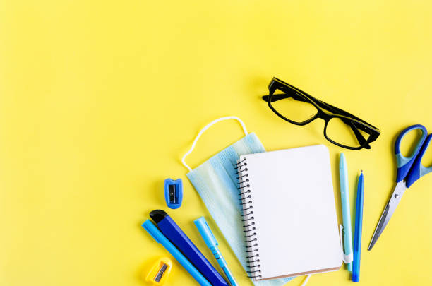 istock School supplies on yellow background. Back to school. 1317257315