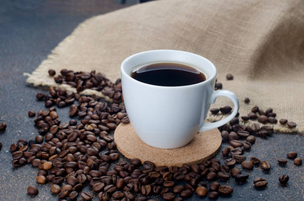 istock cup of i black coffee and coffee beans on dark 1317257334