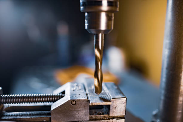 istock Drilling process with shavings close-up at the workplace in workshop 1317259352