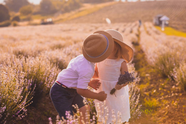 istock Boy And Girl Standing On Field 1317260453