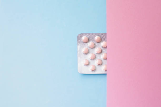 istock Medicine and pills. Plate with tablets on a pink blue background. 1317261098