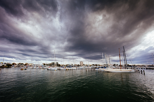 A storm approaches Commonwealth Reserve on an autumn day in Williamstown in Melbourne, Victoria, Australia