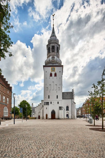 istock a tall white church tower with gold clock 1317264243