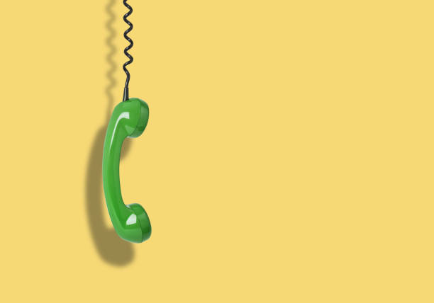 istock Telephone receiver hanging from the cord 1317265528