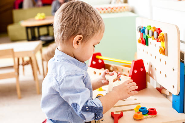 istock Boy Playing With Toy On Table At Home 1317265615