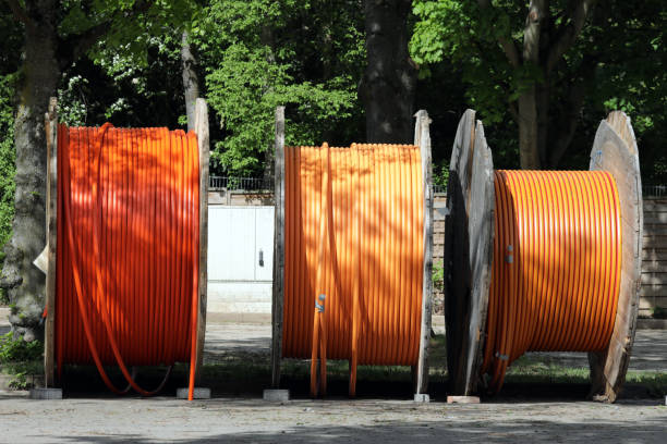 three cable drums on one parking space stock photo