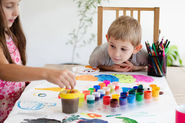 istock Mother And Girl And Son On Table 1317268228