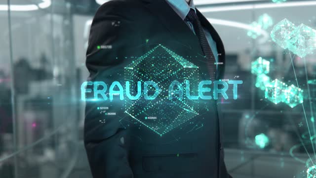 Businessman with Fraud Alert hologram concept