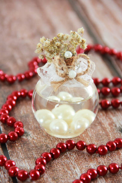istock decorative glass perfume bottle and red beads 1317269830