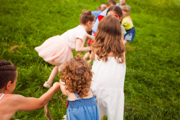 istock Rear View Of Friends On Grass 1317269954