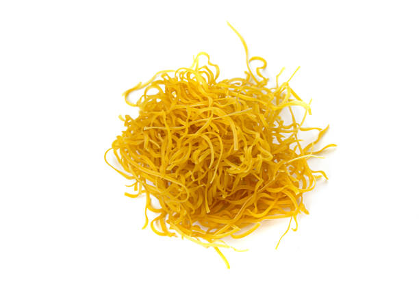 istock handful of instant egg noodles on white isolated background 1317273857