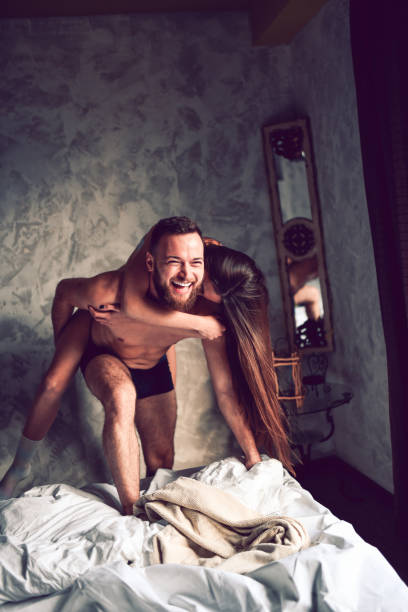 istock Cute Smiling Couple Enjoying Time Spent Together In Bed 1317274355