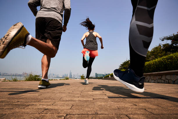 istock young asian people running in seaside public park 1317274425