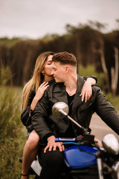 istock Young couple on a motorcycle 1317276684