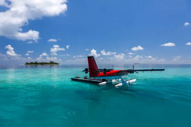 Seaplane landed in lagoon of a resort island in Maldives