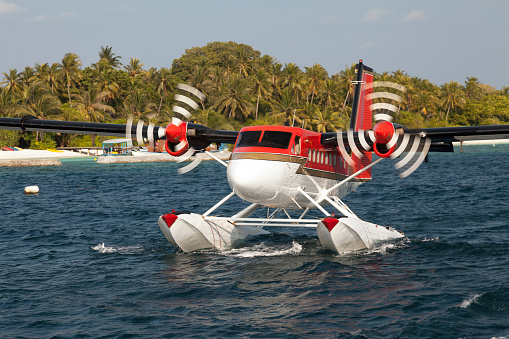 Seaplane taking off from an island in Maldives