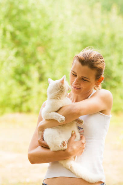 istock Woman Holding Cat 1317280722