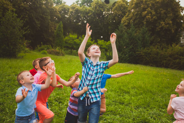istock Children Playing In Public Park 1317281343