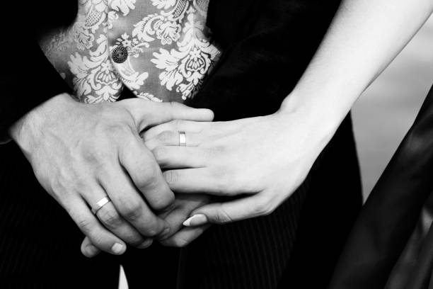 istock Engagement ring on young girl's finger. Black and white image 1317282381