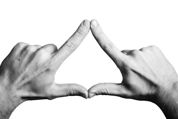 Triangle shape made with fingers. Two hands connected together background.