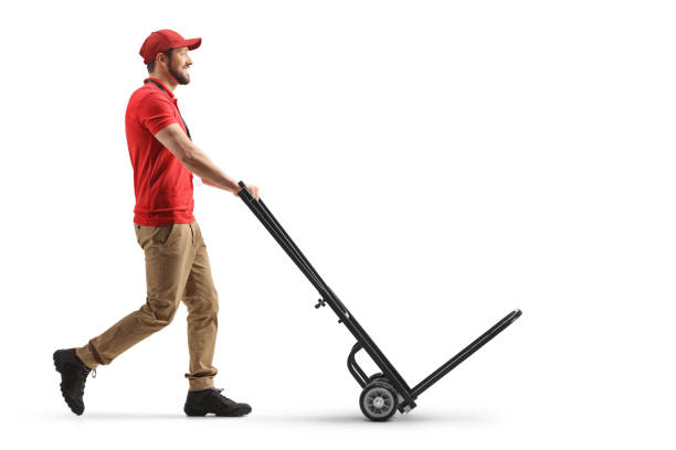 istock Delivery man pushing an empty hand truck 1317285954