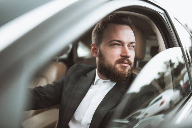 istock Bearded Male Driver Enjoying Car Window View 1317285976
