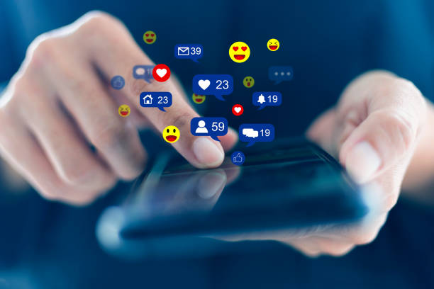 istock Close-up hands holding and touch screen to communicate with others through emoji in a soft blur using the smart phone social media concept 1317287231