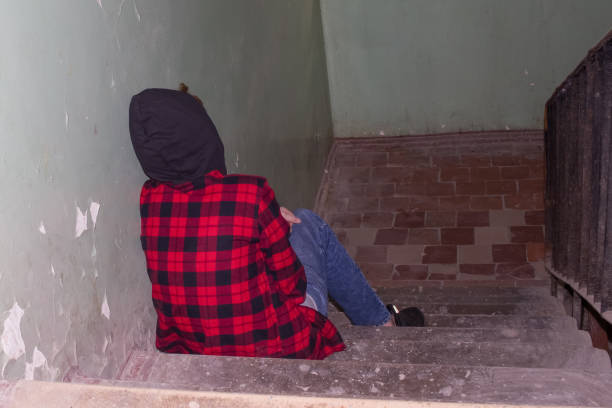 Empty space for text. Upset teenager 11-13 on the stairs alone.