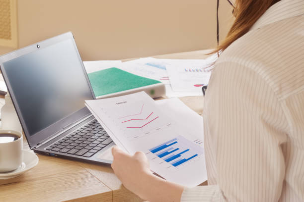 istock Workplace in the office. Laptop, documents, charts, graphs, folders. 1317287637