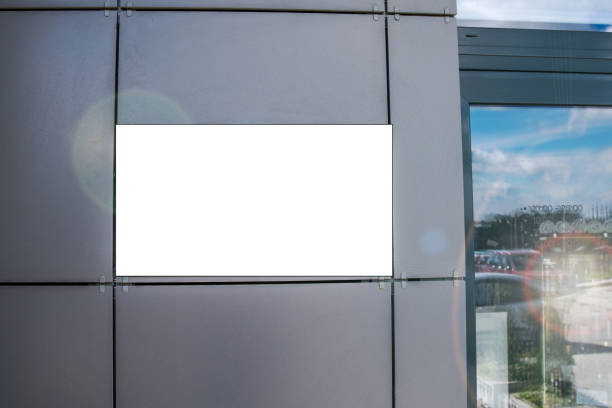 istock Blank white information signage with mockup hangs on gray wall 1317290120