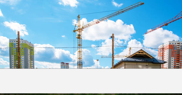 istock Long white hoarding with space for mockup on fence against construction site 1317290127