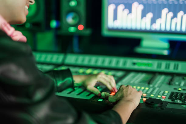 Young girl having fun mixing music inside recording studio