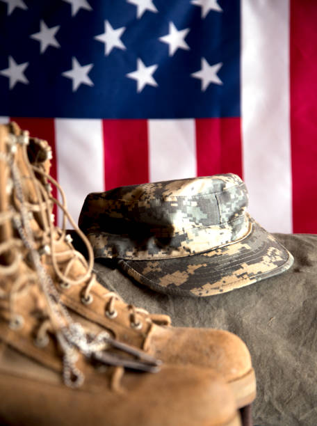 istock US Military Display.  Modern day military boots and cap. 1317293455