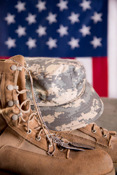 istock US Military Display.  Modern day military boots and cap. 1317293564