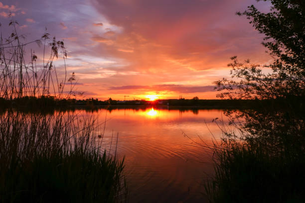 istock Amazing landscape with dramatic sky and clouds over the water. 1317293704
