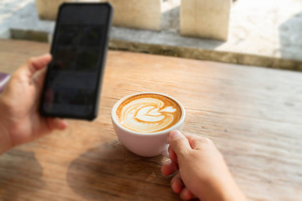istock Morning coffee latte on wood desk work from home office 1317293892