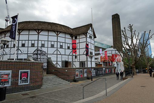 Shakespeare Globe theatre or Sam Wanamaker Playhouse arts centre. Southbank of the River Thames. Outdoors on a gloomy summer day. London, United Kingdom, May 4, 2021