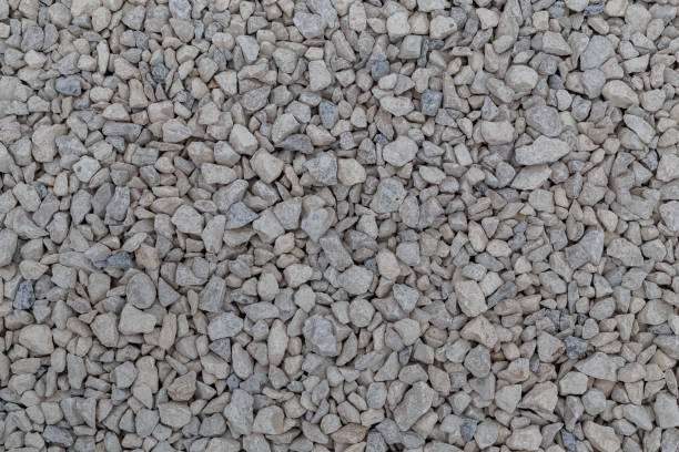 istock Dry white limestone ballast flat full frame background. Small gray dusty broken macadam stones texture. 1317296261