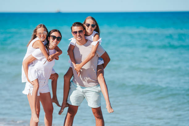 istock Happy family on the beach during summer vacation 1317298726