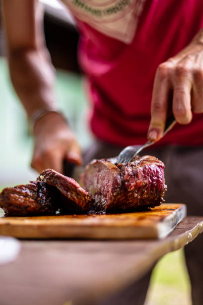 istock barbeque meat preparation in a summer day 1317301561