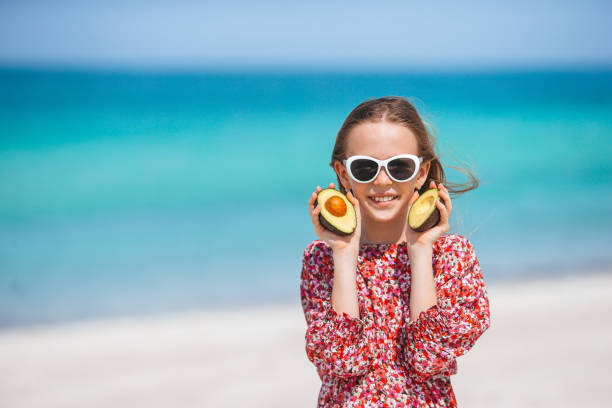 istock Cute little girl at beach during summer vacation 1317302004