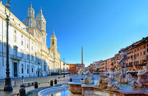 Piazza Navona at sunrise, Rome The Fontana del Moro (Moor Fountain) at Piazza Navona in Rome, Italy fontana del moro stock pictures, royalty-free photos & images