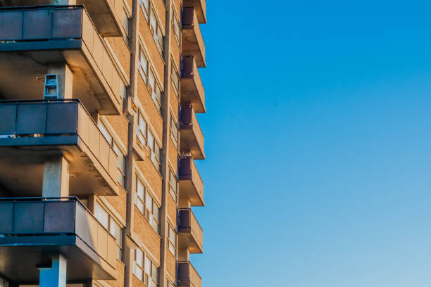 Looking up at a Residential Building against a Blue Sky