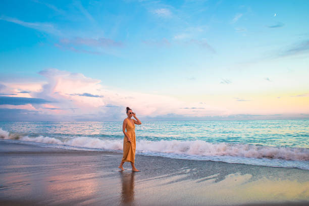 istock Woman on the beach enjoying summer holidays 1317304647